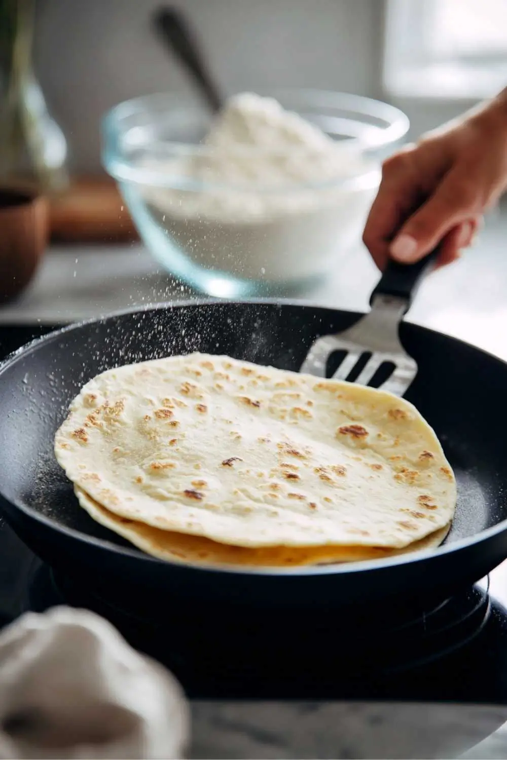 gluten-free-pita-bread-yeast-skillet. Gluten free pita bread with yeast puffing on hot skillet
